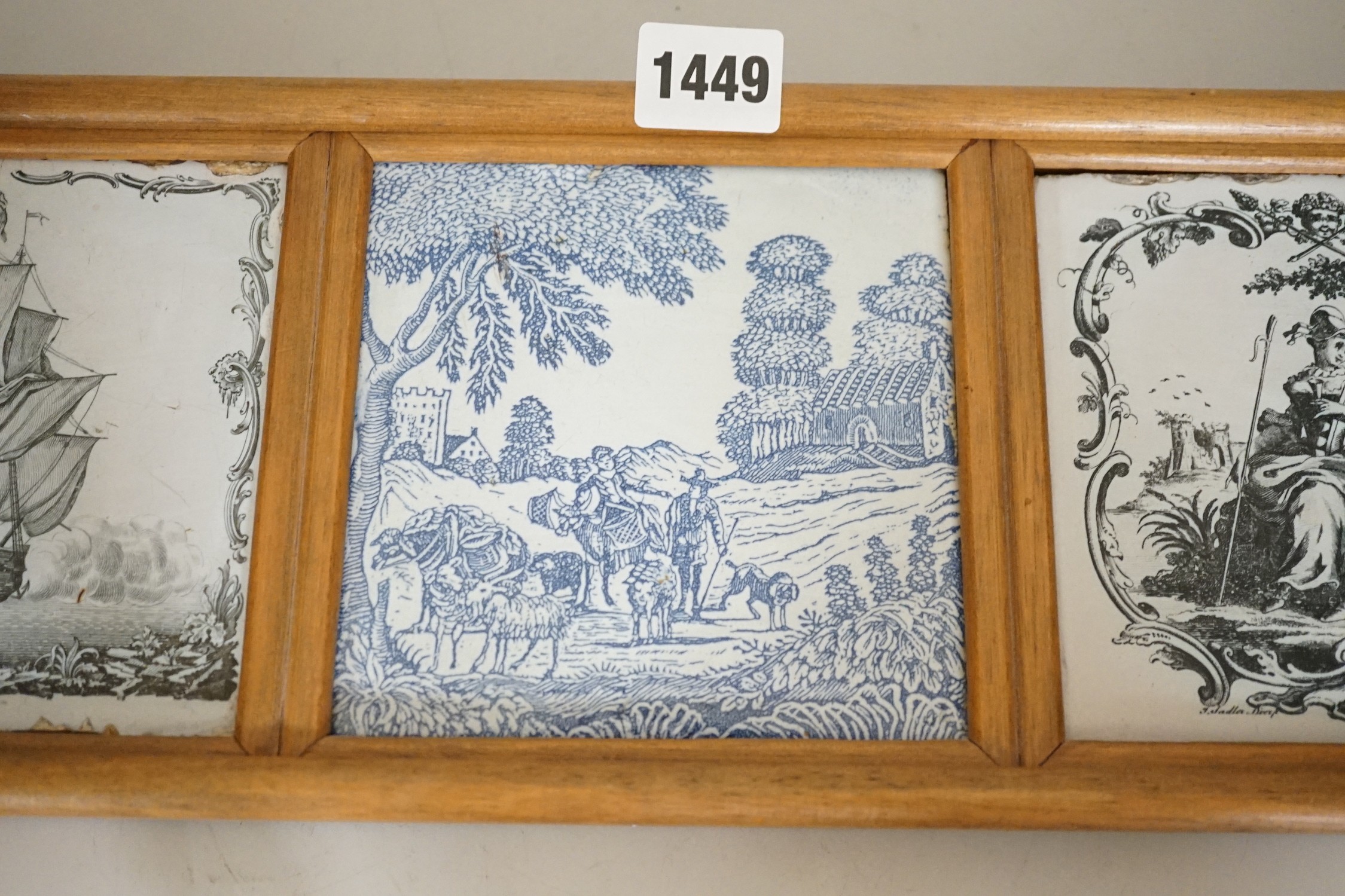Two John Sadler Liverpool delftware black transfer printed tiles, c.1770 and a blue printed tile, in the same wooden mount. Overall 16 x 45cm